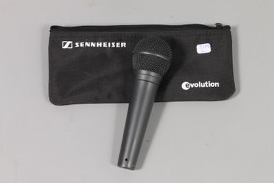 a close up of a microphone and a pouch on a table