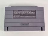 an old nintendo game console sitting on top of a white table