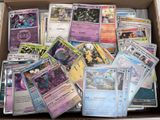 a box full of pokemon cards sitting on a table
