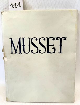 un livre blanc avec des inscriptions noires, posé sur une table