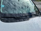 a car that has a sticker on the windshield of it