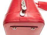 the red purse is open and ready to be used as a handbag