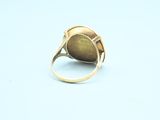 an image of a gold ring with a stone in the middle