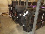many stacks of steel bars in a warehouse
