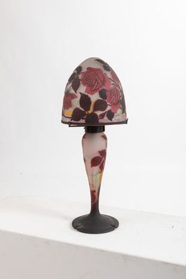 a lamp that is sitting on a shelf in a room