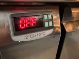 a digital clock on the side of an oven