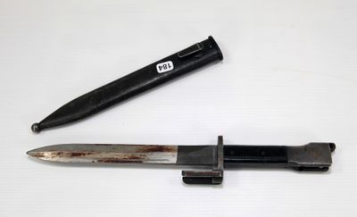 a knife and a pen sitting on a table