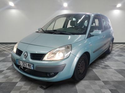 a picture of a small blue car parked in a garage