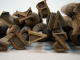a pile of old brass bells sitting on a table