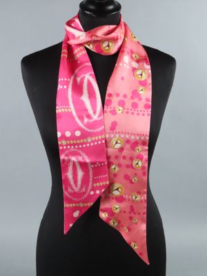 a close up of a pink scarf on a mannequin mannequin
