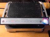 a toaster that is sitting on a wooden table