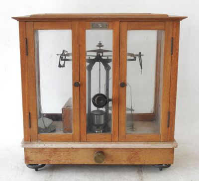 a wooden case with a clock inside of it