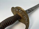 a close up of a sword with a rope on it