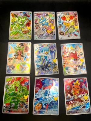 the pokemon cards are lined up on a table