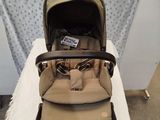 an image of a baby stroller with a baby in it on a table