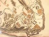 a map of a town on display in a museum