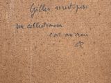 an old picture of a box with writing on it sitting on top of a table