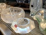 many glass vases on the counter in this room