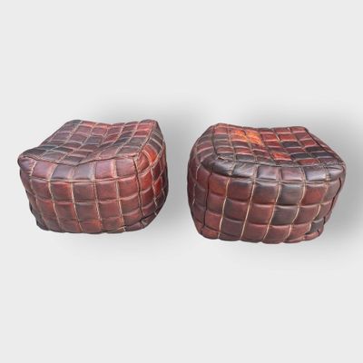 pair of leather stools in the style of a basket