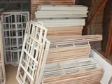 many pieces of wood stacked on top of each other in a room