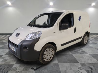 a picture of a white van parked on a checkered floor