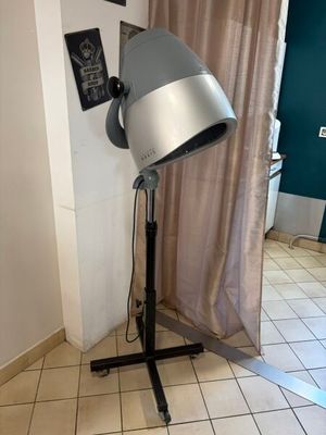 an image of a hair dryer on a stand in a room
