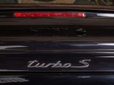 a close up of a car ' s tail light with the word turbo on it