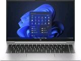 l'ordinateur portable est ouvert sur un fond blanc avec un fond bleu