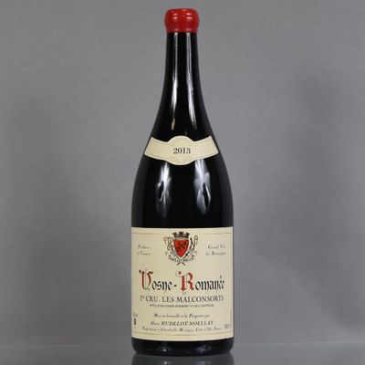 a bottle of wine that is sitting on a table