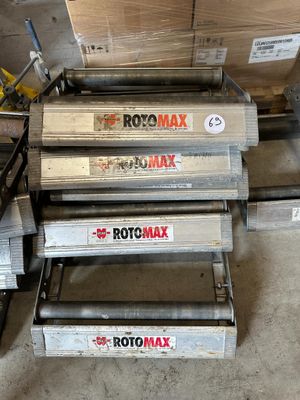 three rolls of rotomax are stacked on top of each other in a warehouse