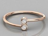 a close up of a diamond ring on a reflective surface
