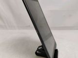 a tablet that is sitting on a stand on the table