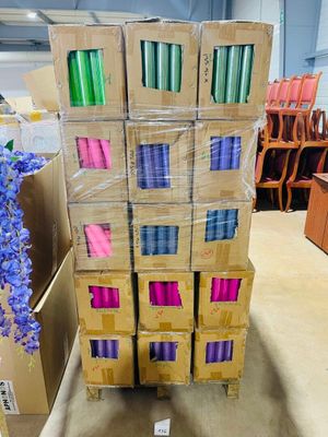 several boxes of yarn are stacked on top of each other in a room