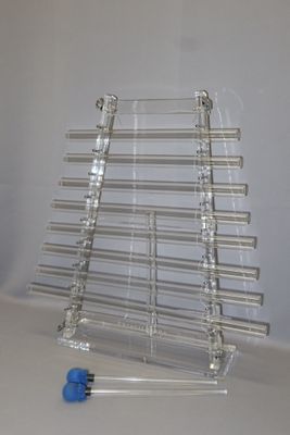 clear acrylic display rack with blue knobs on a white surface
