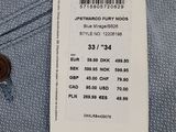 a close up of a label on a shirt with a tag on it