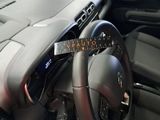 a steering wheel with a ruler on it in a car