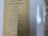 a picture of a menu in a frame hanging on a wall