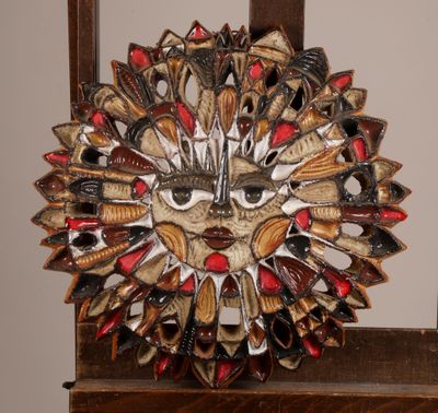 a picture of a decorative mask made out of spoons