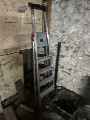 a ladder that is leaning against a wall in a room