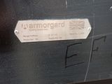 a sign on the side of a black suitcase
