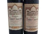 two bottles of wine that are sitting next to each other