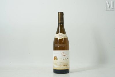 a bottle of wine that is sitting on a table
