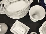 a lot of dishes and cups that are on the table