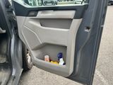 a car door with a bottle and a bottle holder in it
