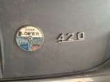 a close up of a badge on a car ' s hood