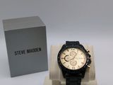 a watch that is sitting on a stand in front of a box