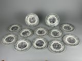 six plates with black and white designs on them on a table
