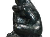 statue of a woman sitting on her knees on a white background