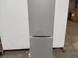 a refrigerator that is sitting on a pallet in a warehouse