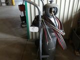 a fire hydrant with a hose attached to it in a garage